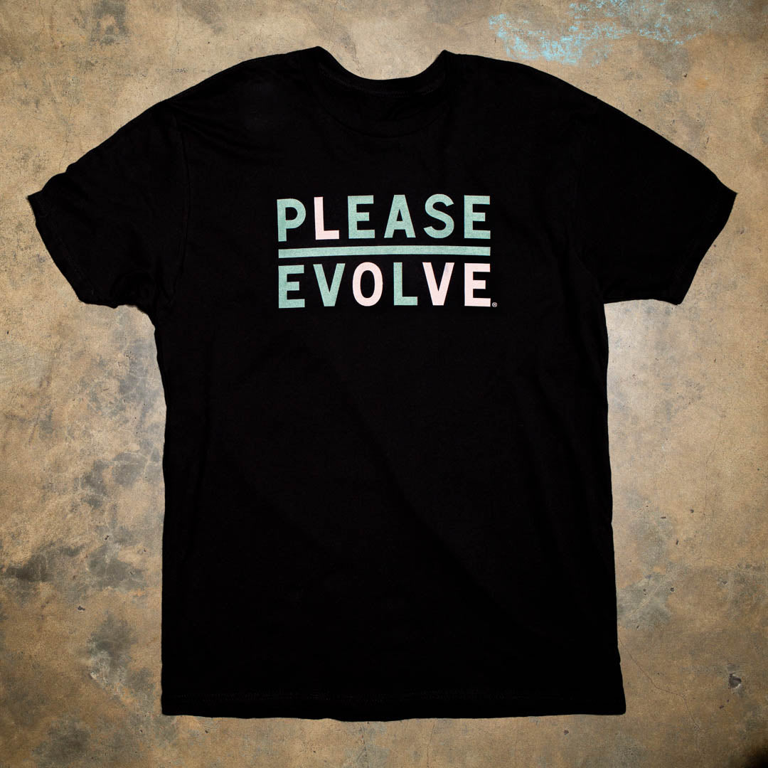 Please Evolve but with a twist. Please Love is a new version of our logo. Light Green with Pale pink print. 100% Black Cotton t shirt. Stylish colorways. Look for the limited edition colorways to benefit nonprofits.