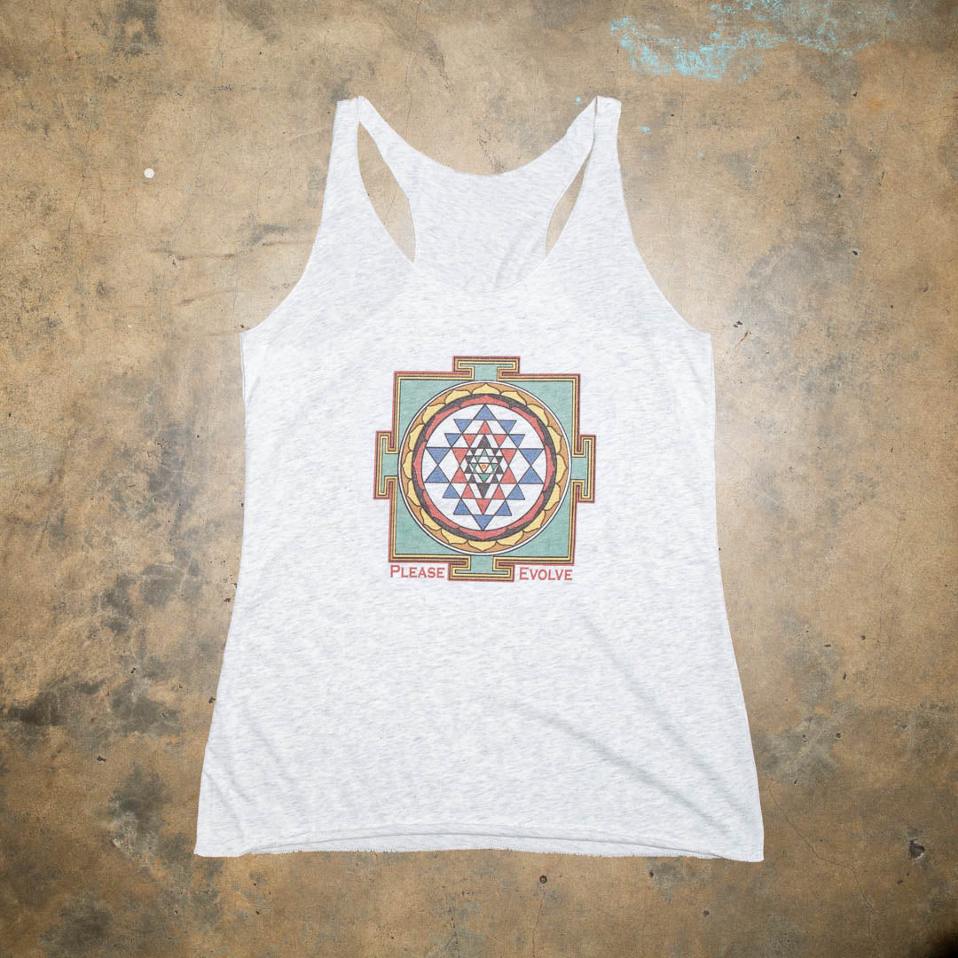 Do some yoga, meditate and chill before you hit the busy streets.  Keep the vibe alive with this classic and authentic mandala design.  Heather Gray tri blend racer back. Super soft for a vintage look and feel.  Vintage mandala graphic with muted earth colors.